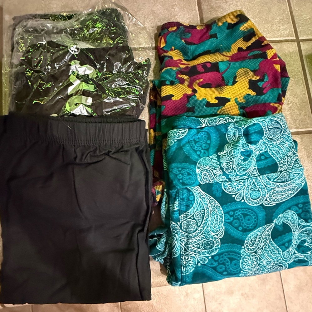LuLaRoe Teal with paisley skulls, multi colored dachshund leggings and 3 black.